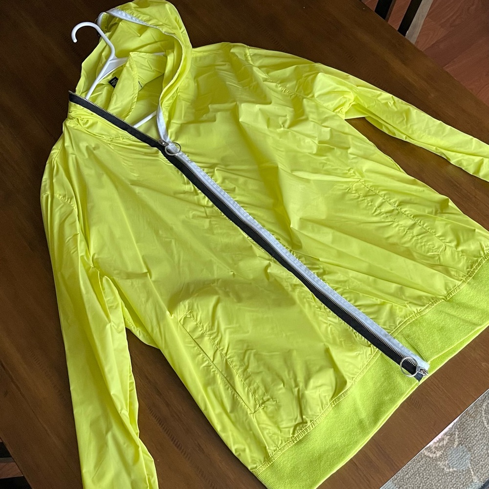 Yellow Wind Breaker. NEVER WORN.
